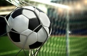 football. The ball flies into the net gate